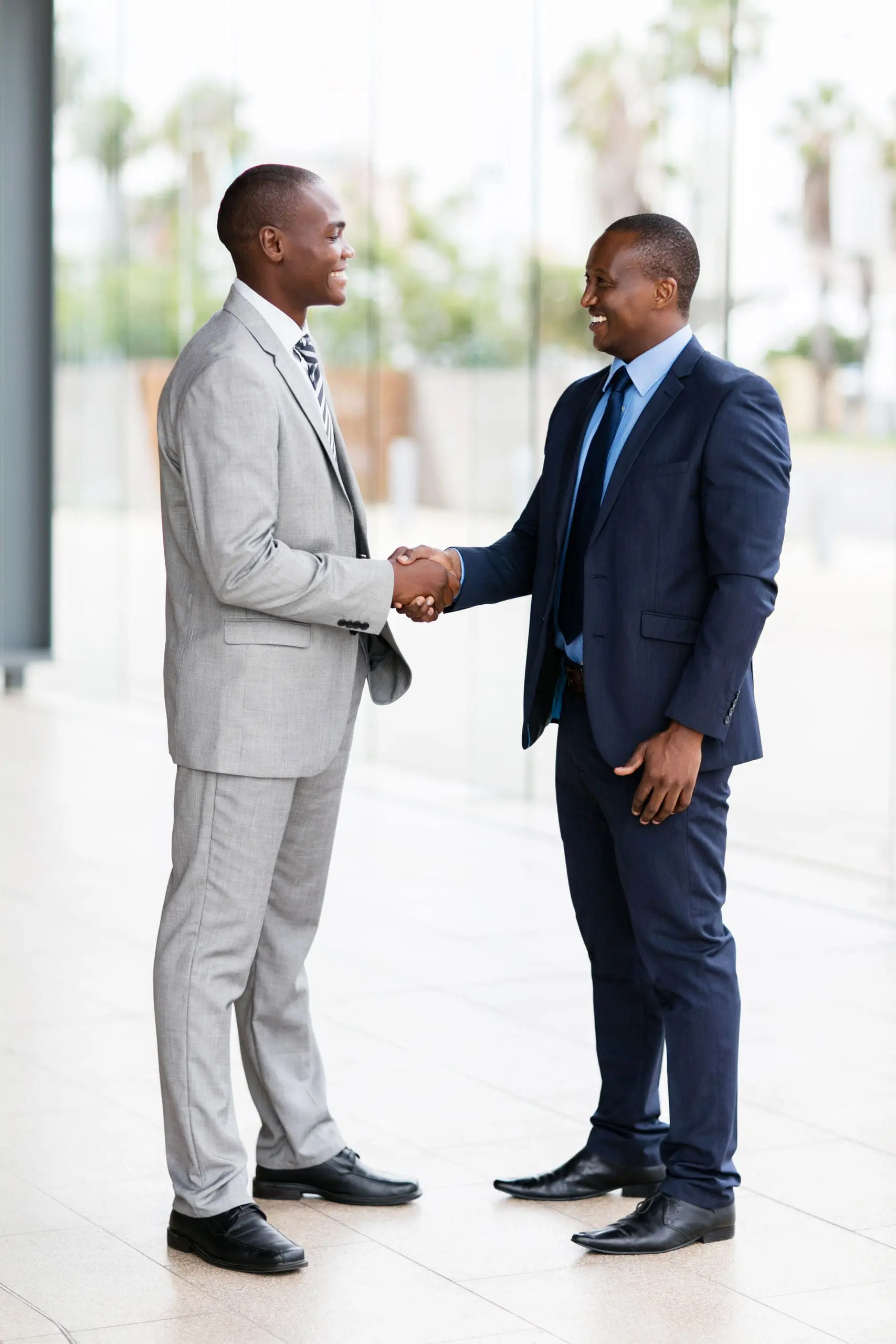 african businessmen handshaking rhino ig experts in negotiations africa installation services